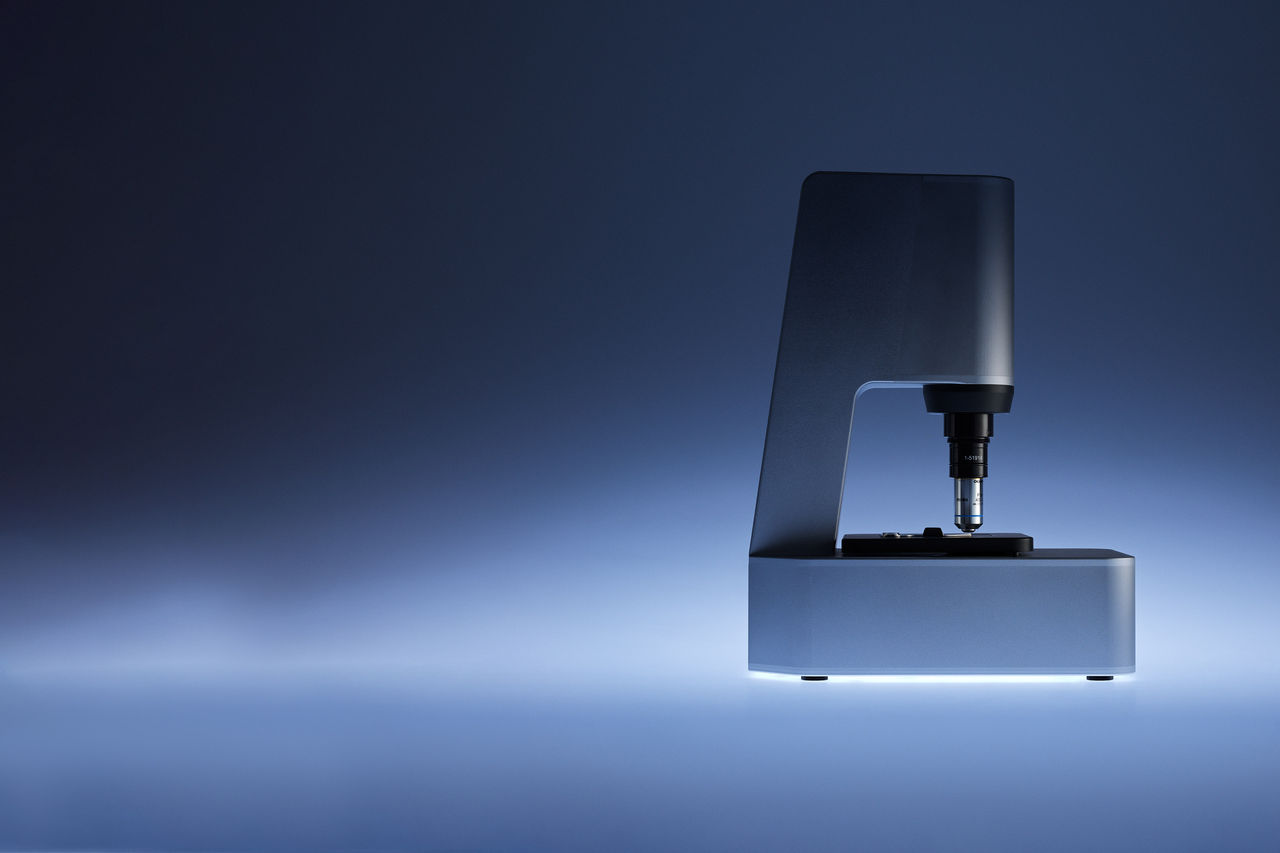 microscope on blue background