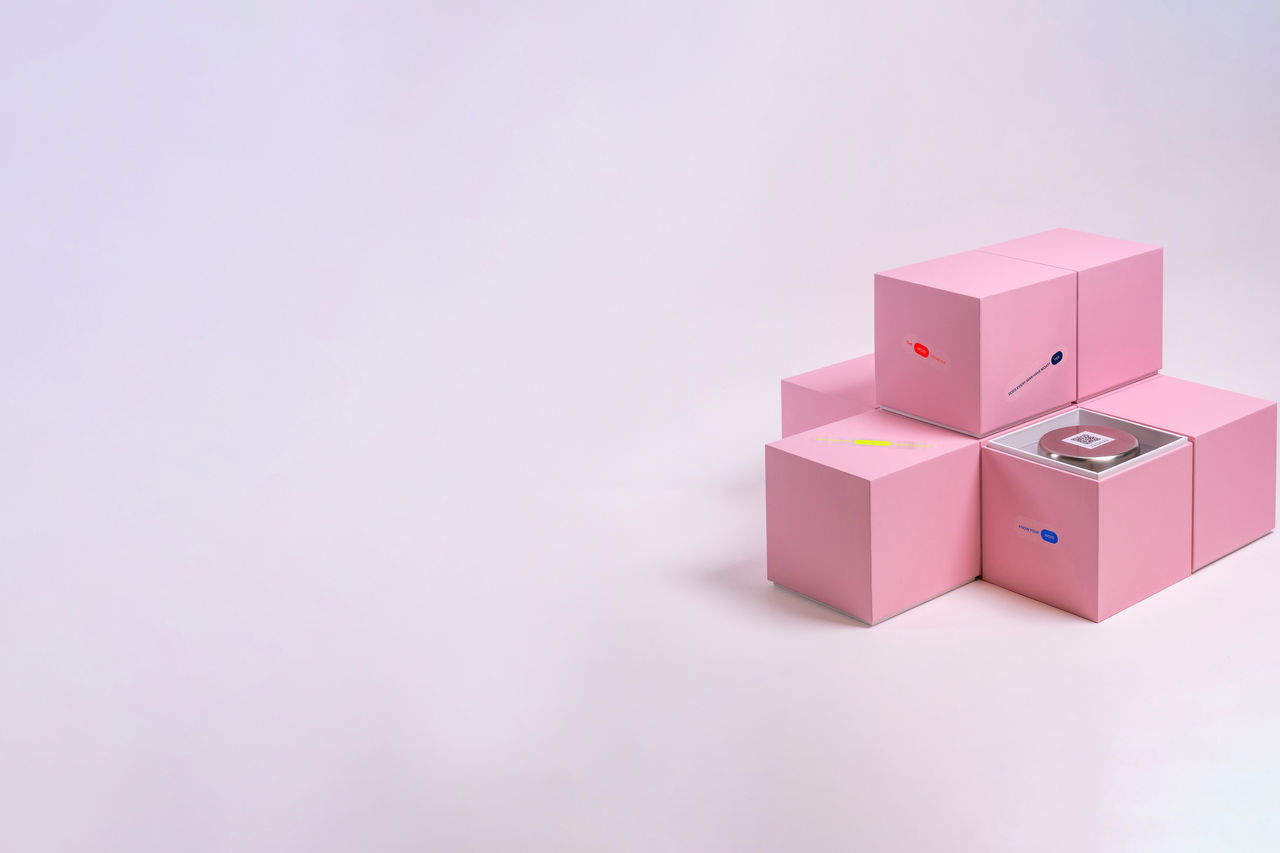 home testing kits stacked in pink boxes